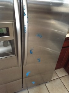 blue leprechaun on fridge